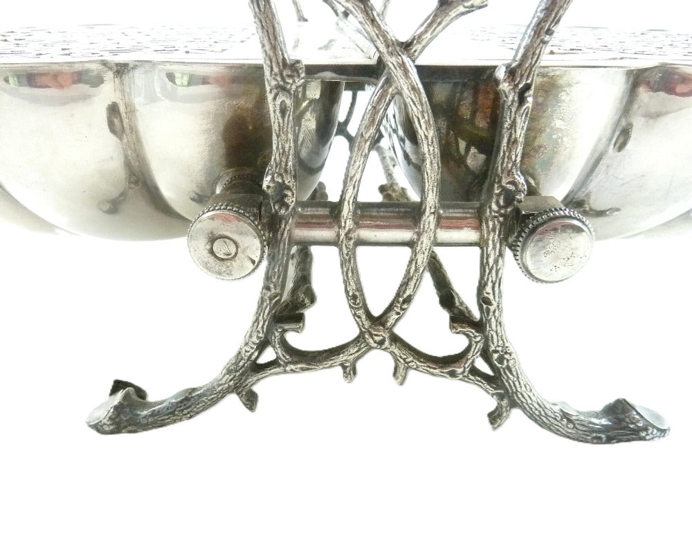 View of antique biscuit warmer's naturalistic cast frame stylized to mimic organic tree branches